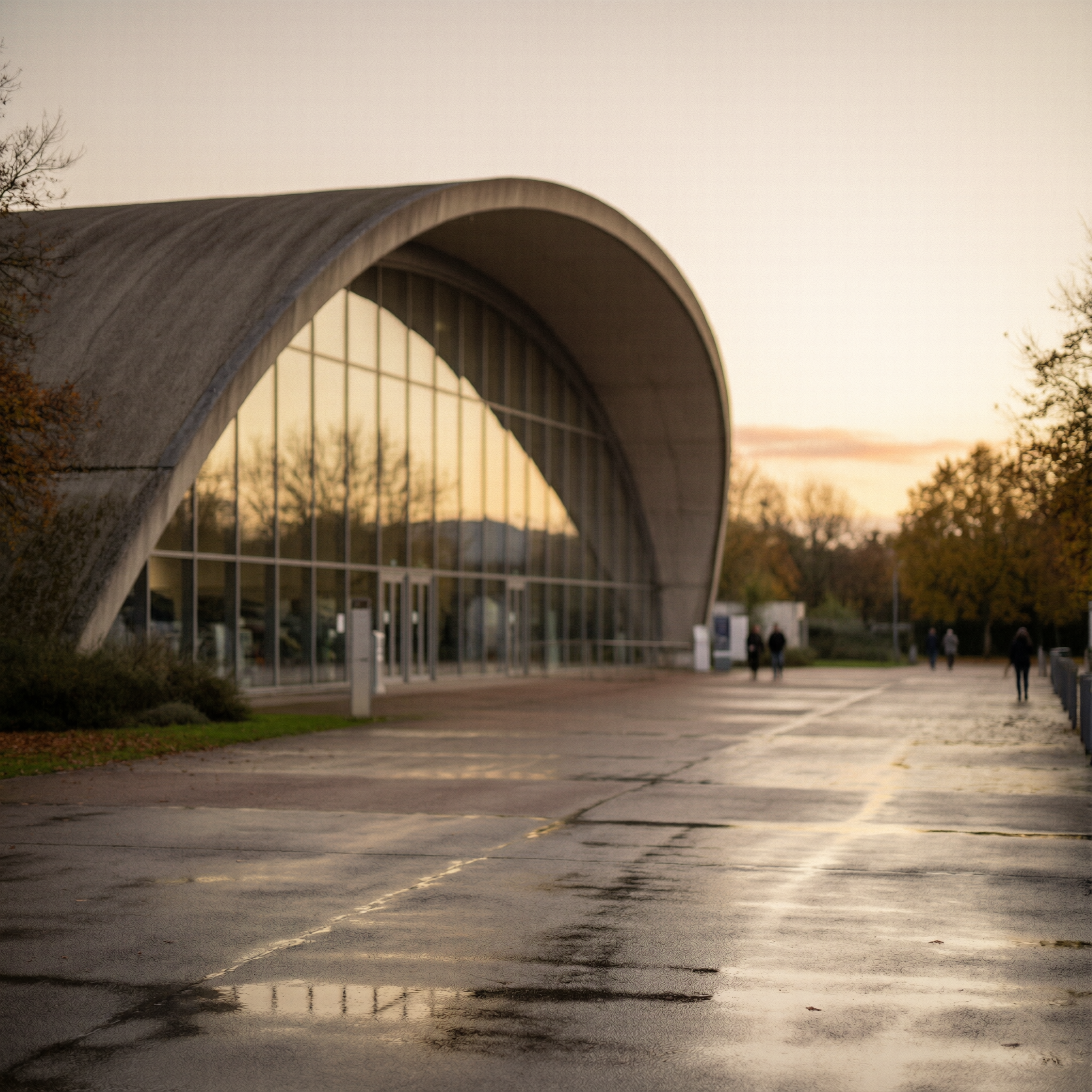 Toulouse Aerospace Museum Visit 5 Aeroscopia Museum exterior in Toulouse showing distinctive curved white architecture with large arched entrance and glass facade